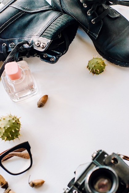 black boots lie with camera glasses acorns 73763 518